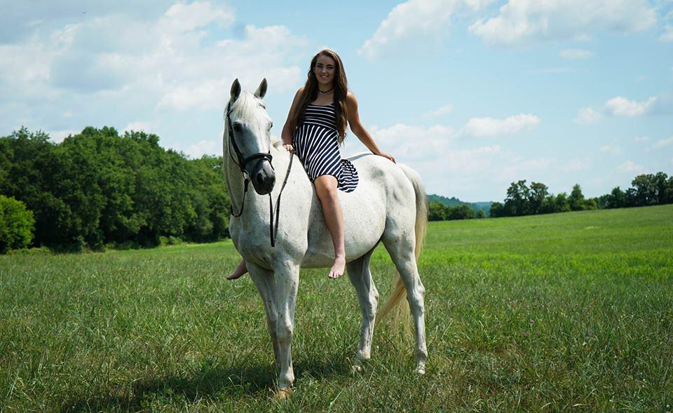 A photo of Rachel and beloved horse from Higgins' Facebook page