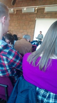The congregation bows their head in prayer as Buchan gives his sermon