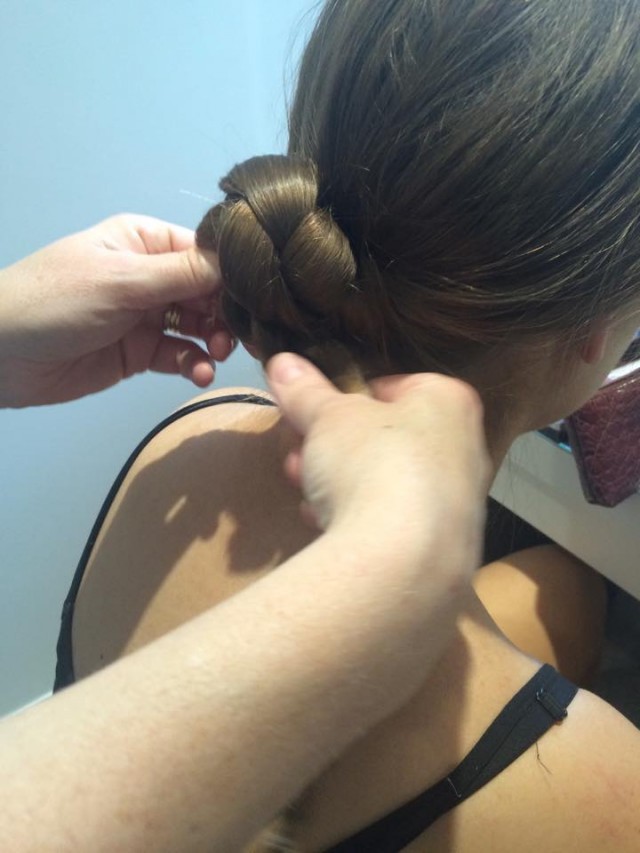 Twist the plait into a low bun at the nape of the neck and secure with grips.