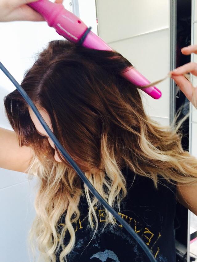 Once hair has been spritzed with heat defence take a curling wand (a conical wand - where the thickness of the curler goes from fat to thin - works wonderfully) to random sections in a downward motion. Curl hair away from the face for the perfect wave. If you desire a neater look simply divide the hair into sections and wave piece by piece.