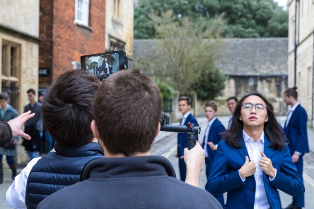 Out of the Blue, a group of posh toffs from Oxford University have released the most cringeworthy Christmas single of all time - an all-male choir rendition of 'Santa Baby.' See SWNS story SWCRINGE. Out of the Blue, a 12-piece a cappella group, shot a cheesy video for the festive hit which captured them in action all over famous Oxford landmarks - serenading each other. The lyrical lads donned blue suits and Santa hats for the quirky rendition of Eartha Kitts much-loved classic and combined tight harmonies with outrageous choreography. Last year, they racked up over SIX MILLION views with a cover of ShakiraÃs ÃHips donÃt lieÃ which made a whopping Ã10,000 for a childrenÃs hospice. Helen and Douglas House, in Oxford, was the first hospice for children in the world, and running purely on donations, has benefitted hugely from the groupÃs fundraising efforts.