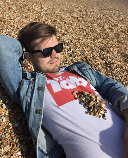 brighton beach hot guy sunbathing