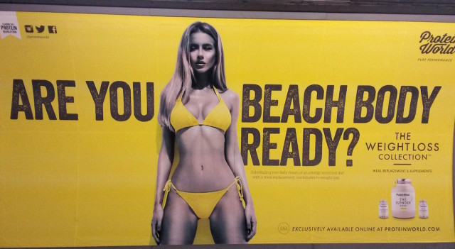A Protein World advert displayed in an underground station in London which says "Are you beach body ready?" as a petition calling for its removal gathers tens of thousands of signatures. PRESS ASSOCIATION Photo. Picture date: Monday April 27, 2015. The Advertising Standards Authority (ASA) said it has received 216 complaints about the ad, and a spokeswoman said the general nature of the complaints is that the ad is "offensive, irresponsible and harmful because it promotes an unhealthy body image". An investigation has not been launched but the ASA said they are "carefully assessing" the complaints to "establish if there are grounds for further action". See PA story HEALTH Body. Photo credit should read: Catherine Wylie/PA Wire
