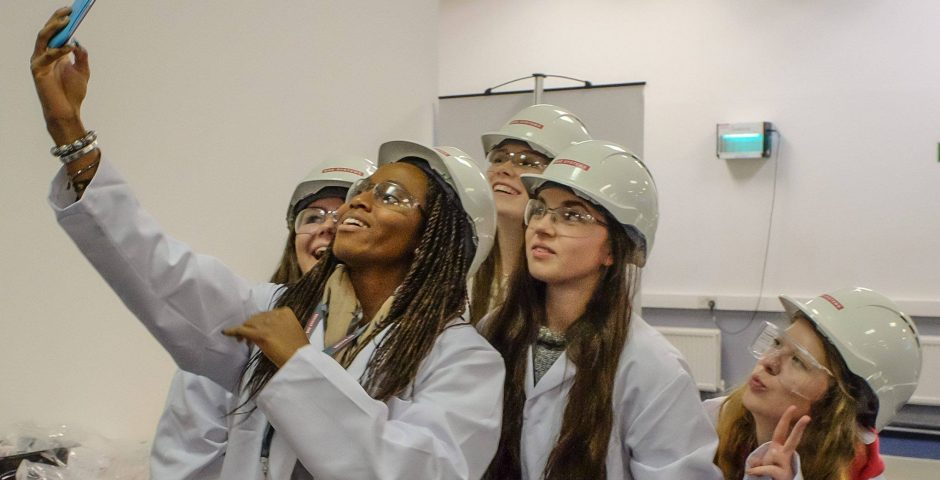 some young girls studying engineering