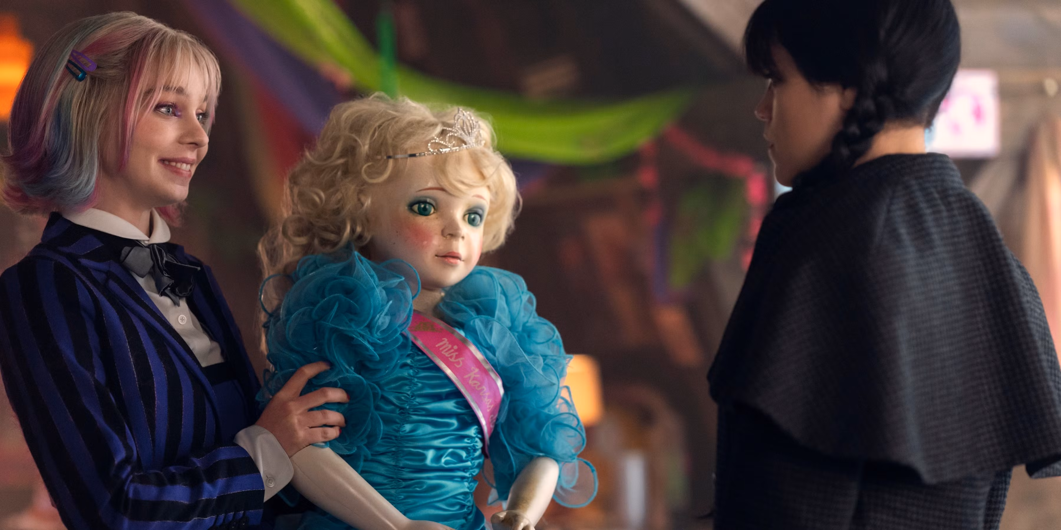 enid and wednesday and a creepy doll in wednesday season two