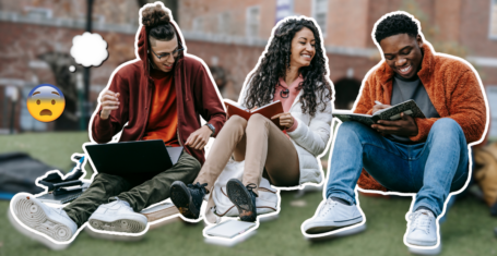 students sitting on grass