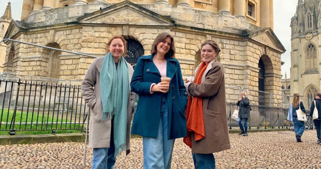 some uk uni students posing in front of the university of oxford which is the second best uk uni according to the daily mail