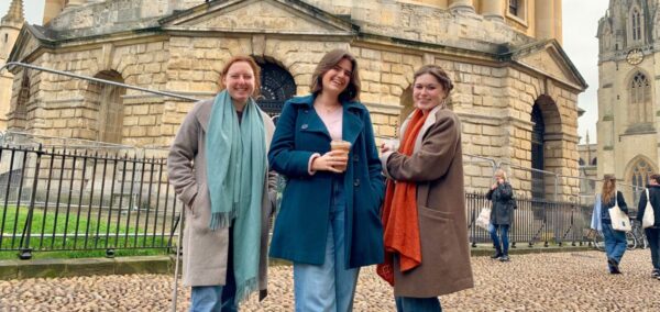 some uk uni students posing in front of the university of oxford which is the second best uk uni according to the daily mail