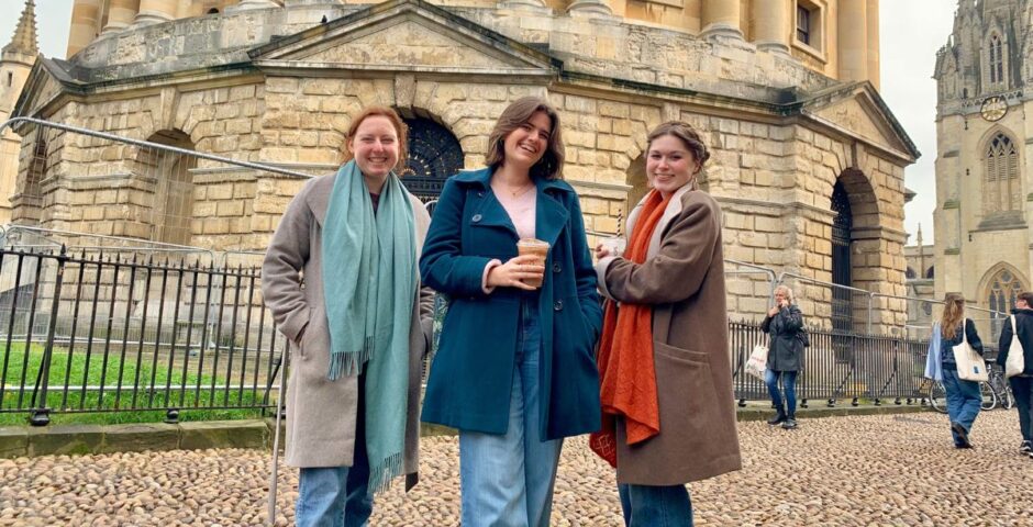 some uk uni students posing in front of the university of oxford which is the second best uk uni according to the daily mail