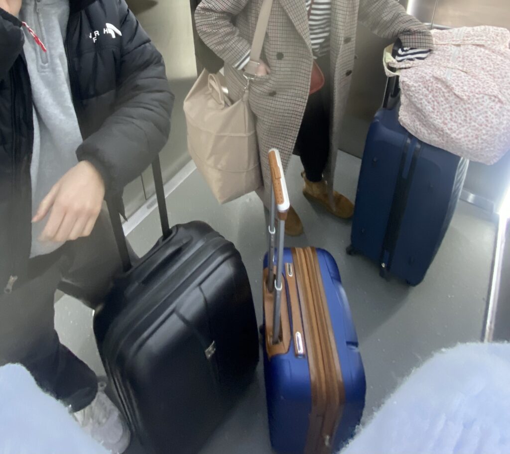 students with a lot of suitcases
