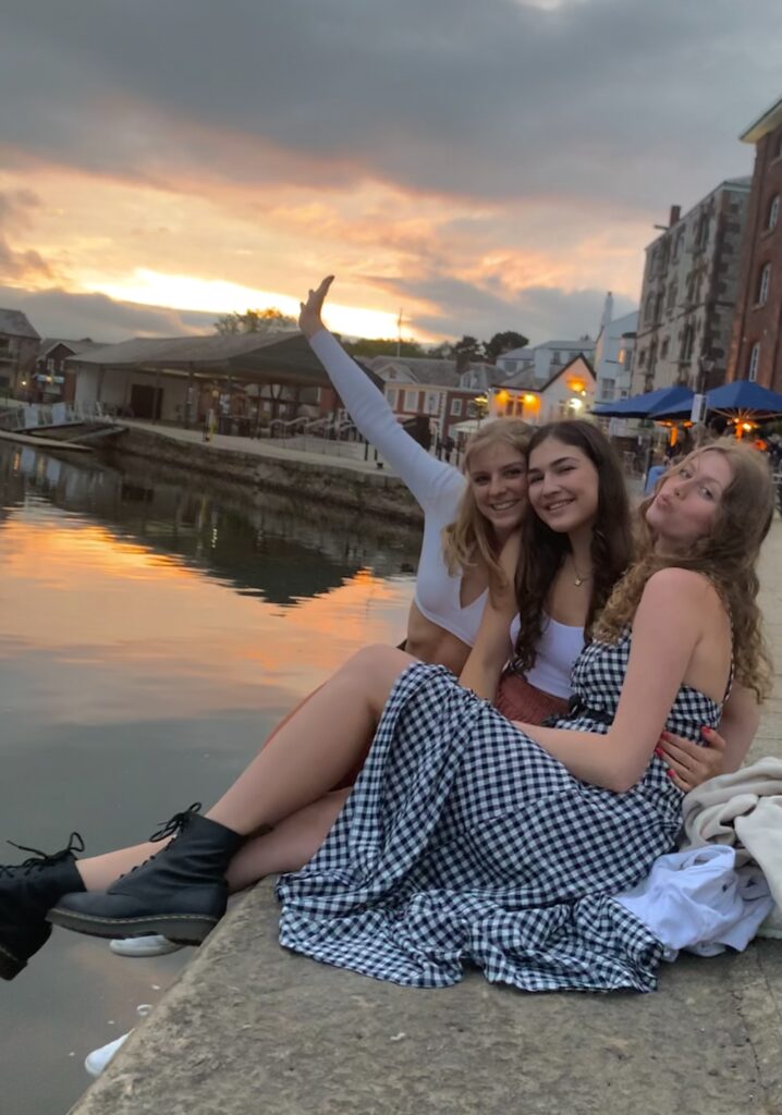 university of exeter students at a beach sunday times guide