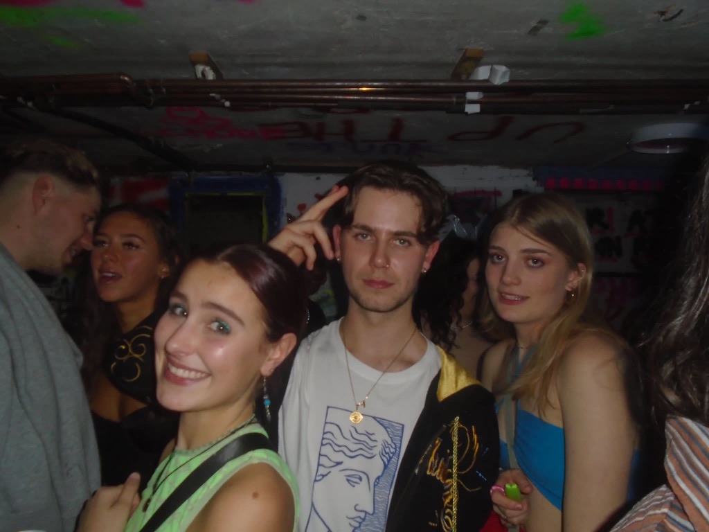 Students partying in a basement