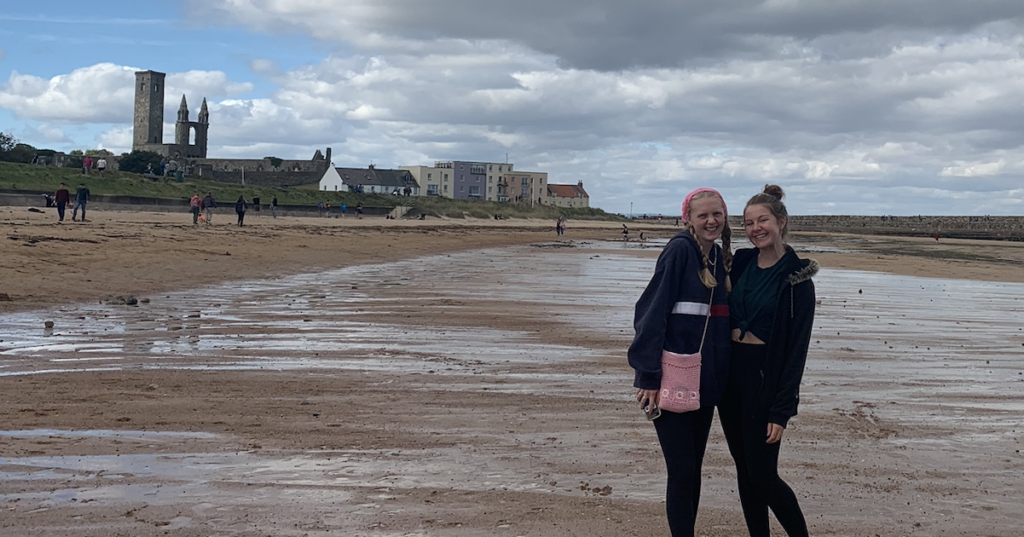 university of st andrews students by a beach