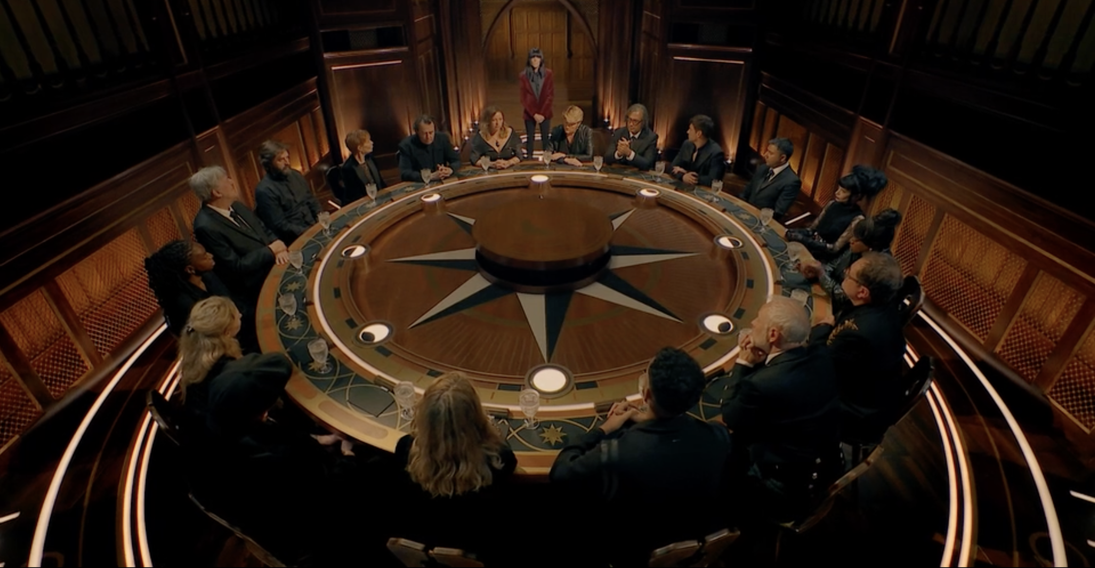 the celebrity traitors cast at a round table