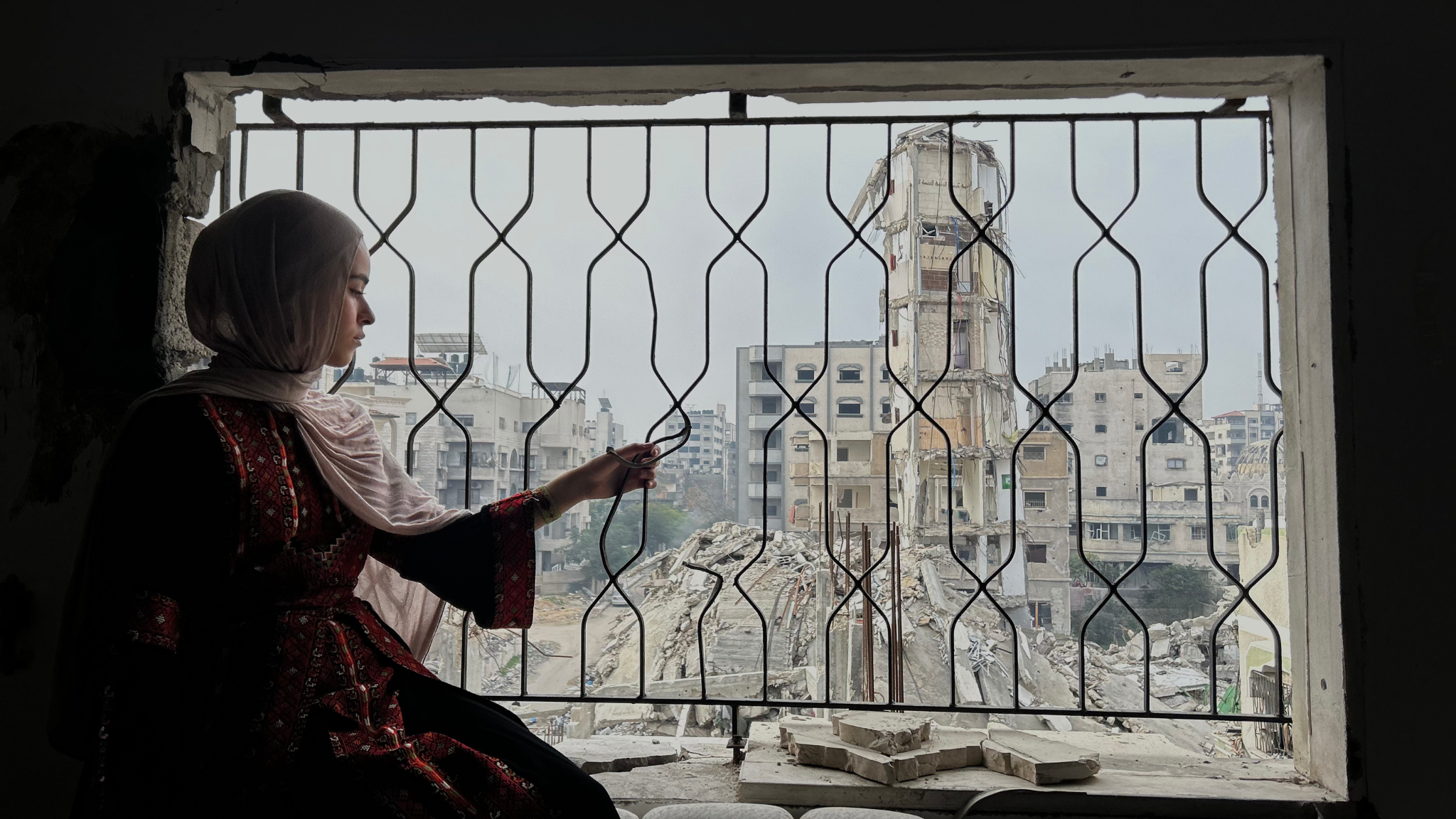 Yara, a Sheffield student, looking out from her bedroom in Gaza