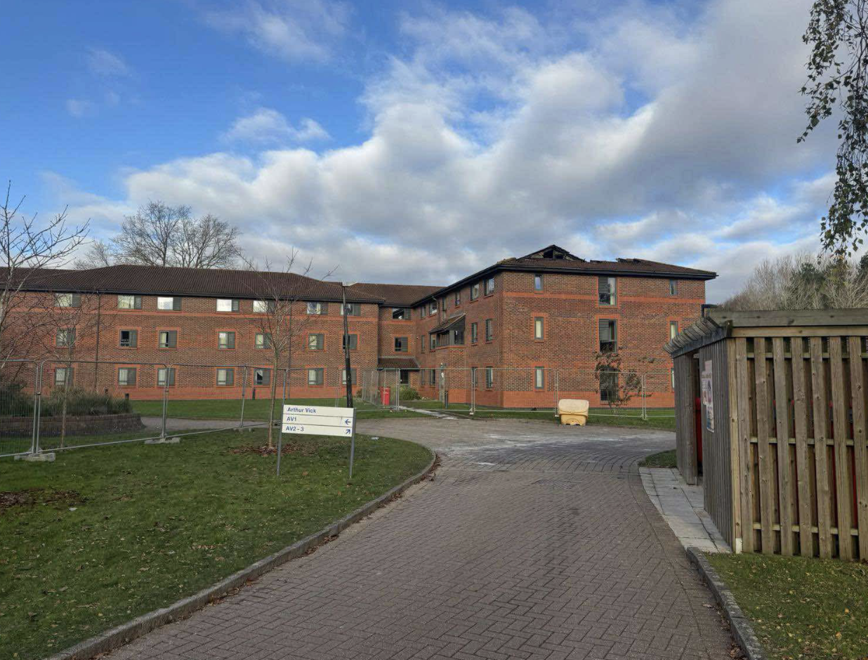 The Arthur Vick residences after the fire, with a top flat missing its roof from the fire