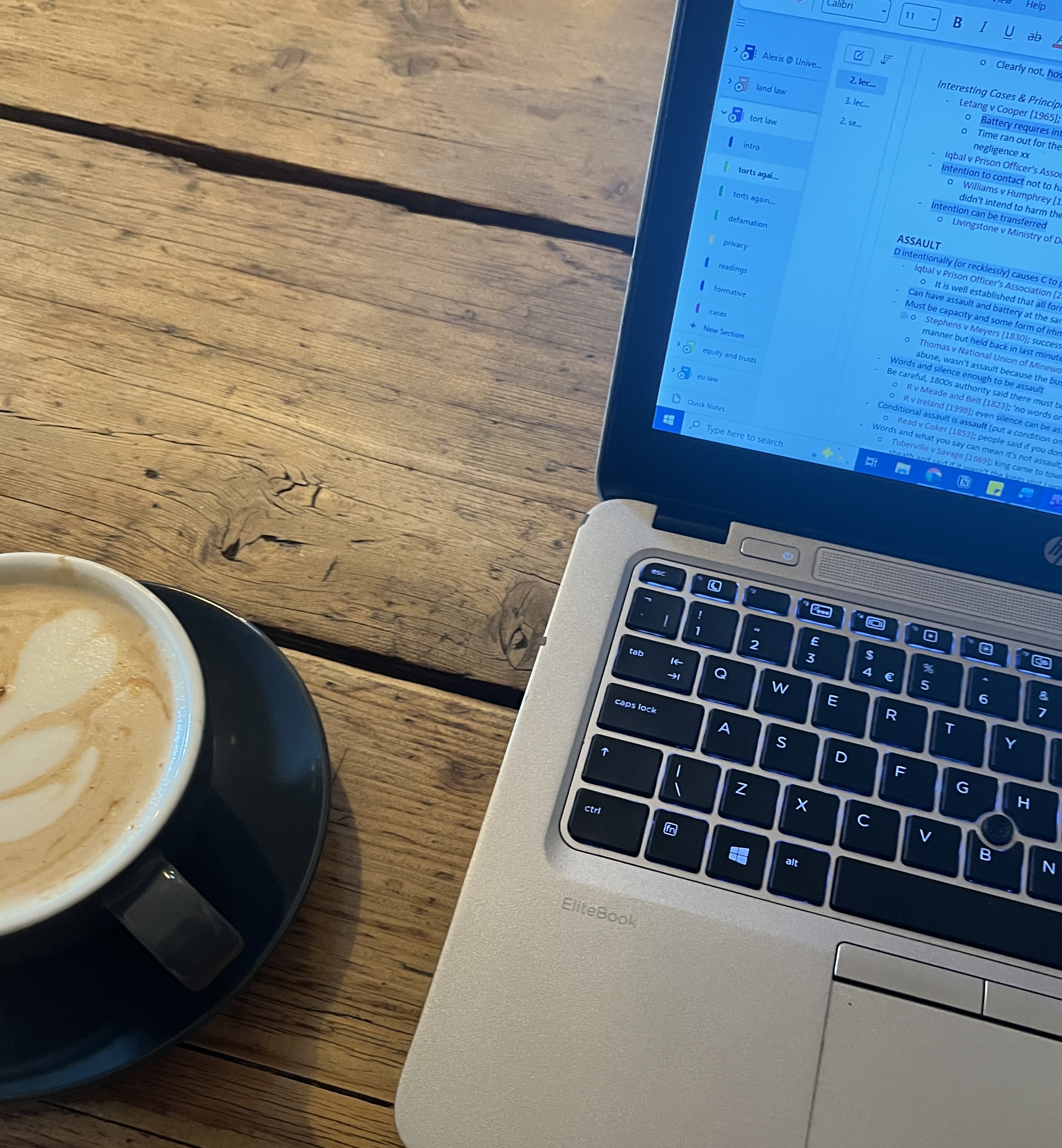 Coffee and a laptop at a cafe