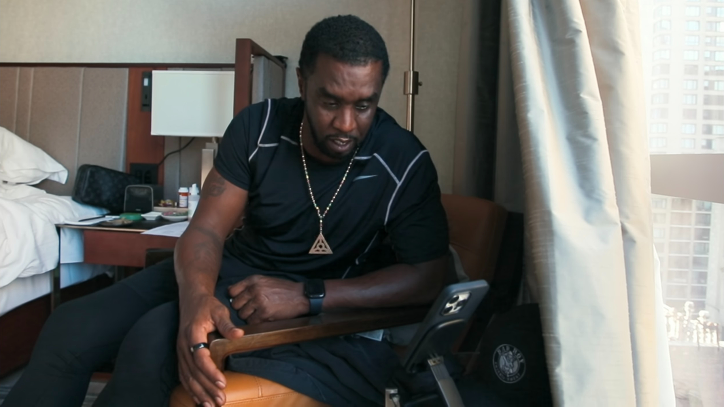 Diddy, necklace, symbol, Sean Combs: The Reckoning