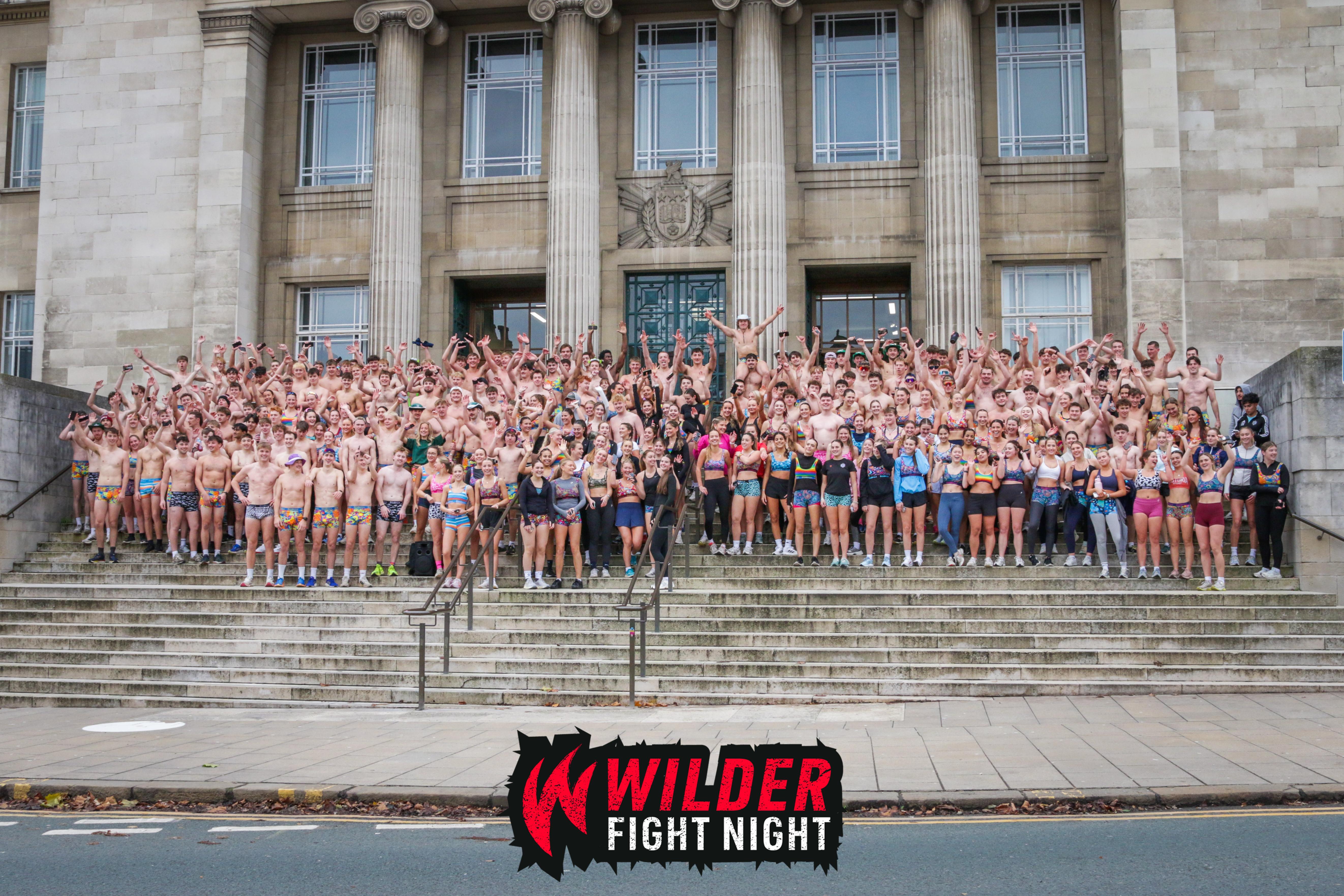 Students wearing not a lot of clothes outside of Parkinson